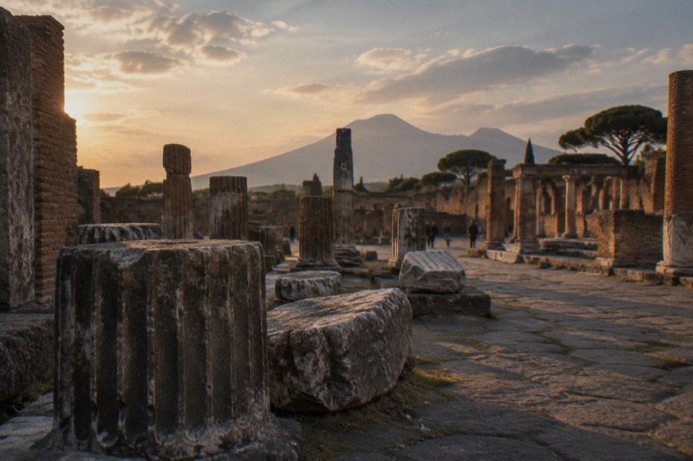 Stone pathway between ruined walls in the archaeological park at Pompeii